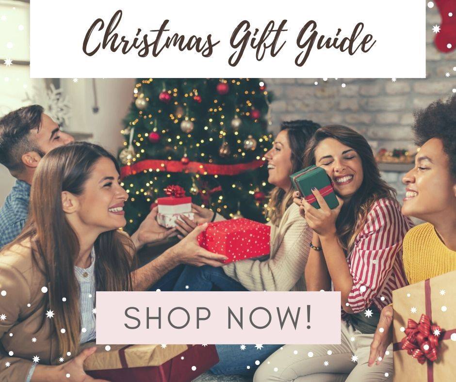 Christmas gift guide image of friends exchanging Christmas gifts